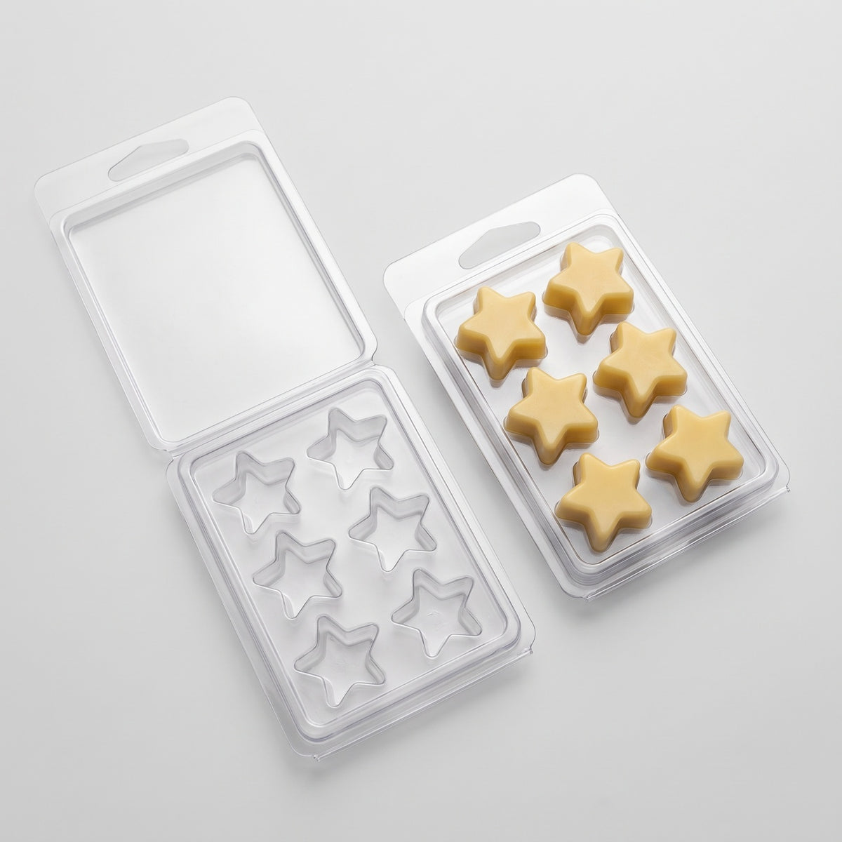 Matriță clam shell 6 stele pentru wax melts, tavă deschisă lângă tavă închisă cu stele galbene